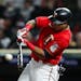 Luis Arraez of the Minnesota Twins hits a single against the Los Angeles Angels in the fifth inning at Target Field on Saturday, Sept. 24, 2022, in Mi