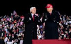 Vice President Mike Pence and President Donald Trump during a rally in Grand Rapids, Mich., on Nov. 2, 2020. 