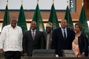 From left, Kenya’s former president Uhuru Kenyatta, lead negotiator for Ethiopia’s government, Redwan Hussein, African Union envoy Olusegun Obasan