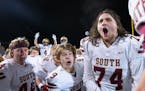 Lakeville South players including center Brecken Klein (74)  celebrate after defeating Stillwater 37-14 in a Class 6A quarterfinal game.