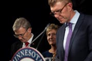 Republican gubernatorial candidate Scott Jensen bowed his head as his running mate Matt Birk spoke as they conceded the race to Gov. Tim Walz at the v
