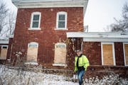 City inspector Jay Voight gave a tour of the Schroeder house in Shakopee on Monday. A state committee will decide Tuesday whether a historic brick hou