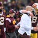 Gophers quarterback Athan Kaliakmanis listened to coach P.J. Fleck after a touchdown in the 2022 victory against Northwestern as former starter Tanner