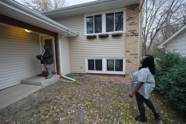 Realtor Nene Matey-Keke (left), showing a house to his client, Arlisa Bullock who has looked at about 40 homes since August.