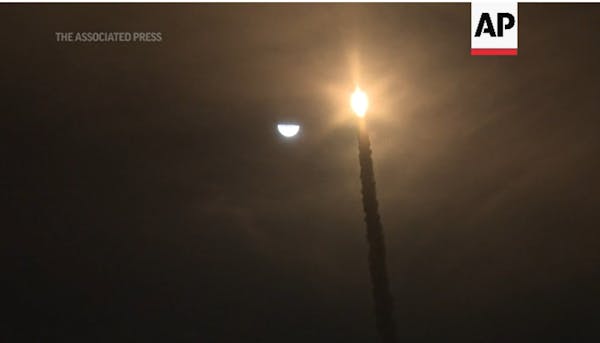 Spectators watch as NASA launches new moon rocket