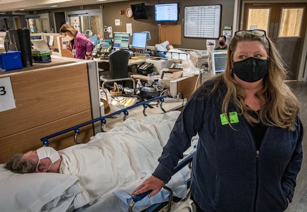 Jennifer Heifort of Big Lake waited with her mother Mavis Peterson to be seen by a cardiologist in the emergency department in Maplewood. Health care 