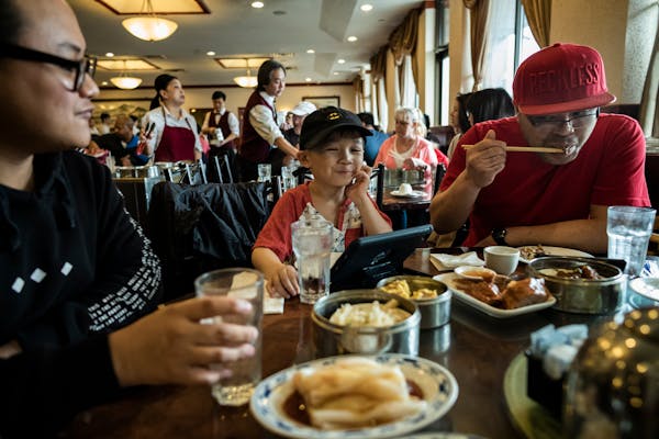 With his nephew Saiyan Ren part of the dining experience, far left, Sawanree Ren enjoys bringing his youngest son Jaxson,5, to eat dim sum . The famil