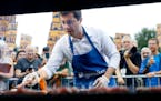 Democratic presidential candidate Pete Buttigieg worked an Iowa grill during the Polk County Democrats Steak Fry in September 2019.