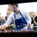 Democratic presidential candidate Pete Buttigieg worked the grill during the Polk County Democrats Steak Fry in Iowa in September 2019.