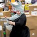 Mankato had the lowest unemployment rate of any city in the country in September. File photo of a worker at Fun.com, the Mankato-based online seller o