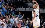 Jordan McLaughlin celebrated a three-pointer during Monday’s victory over Miami at Target Center.