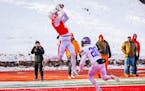 St. John’s receiver Jimmy Buck mads one of his two TD receptions in the Johnnies’ 49-0 victory over Northwestern (St. Paul) last Saturday in Colle