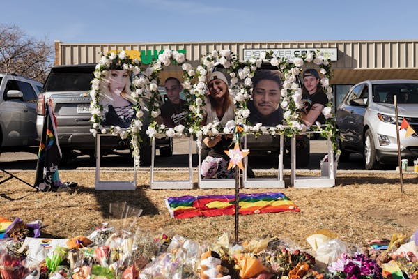 A makeshift memorial stands in front of Club Q, where a mass shooting on Saturday night left five people dead and 18 people injured, in Colorado Sprin