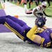 Adam Thielen  was flat on his back after catching the game-winning touchdown pass in the Vikings’ 33-26 victory over New England.