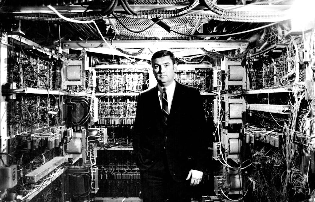 A Univac customer relations manager stands inside the 1950s-era Univac II in 1969.