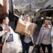 Sarah DeJarnett, Sydney DeJarnett and Gabi Linder brought their first load of Black Friday finds back to their car at the Twin Cities Premium Outlets 