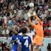 Goalkeeper Matt Turner of the United States makes a save against England’s Harry Kane during Friday’s scoreless tie at the World Cup.