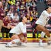 Outside hitter Taylor Landfair of the Gophers bumped the ball in front of libero Rachel Kilkelly last month against Purdue. On Friday, Landfair had 25