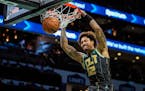 Hornets guard Kelly Oubre Jr. dunked during the first half Friday.