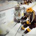 The Gophers’ Matthew Knies (89) battled for the puck with Arizona State’s Jack Judson (22) on Friday night in Tempe, Ariz.