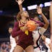 The Gophers’ Rose Micheaux looked to shoot at Virginia on Saturday.