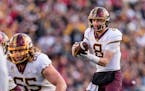 Gophers quarterback Athan Kaliakmanis handled a snap against Wisconsin in the first half Saturday.
