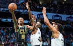 Hornets guard Theo Maledon found a clear path to the basket past Wolves guard Jaylen Nowell and center Karl-Anthony Towns on Friday night. Too often, 