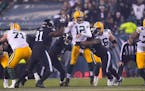 Packers quarterback Aaron Rodgers was hit during the second half against the Eagles on Sunday. He left the game in the third quarter after suffering a