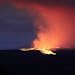 Lava pours out of the summit crater of Mauna Loa about 6:35 a.m. Monday, Nov. 28, 2022, as seen from Gilbert Kahele Recreation Area on Maunakea, Hawai