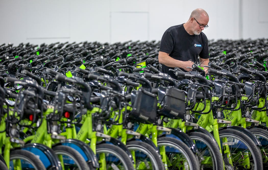 Sean Davis of Nice Ride worked at taking tags off bikes as the company rolled out its fleet throughout Minneapolis April 22, 2019. 