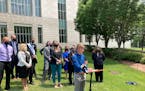 Dylan Brandt speaks at a news conference outside the federal courthouse in Little Rock, Ark., July 21, 2021. Brandt, a teenager, is among several tran