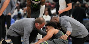 Members of the Timberwolves medical staff attended to Karl-Anthony Towns after he suffered an injury in the second half against the Wizards.