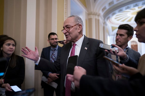 Senate Majority Leader Chuck Schumer, D-N.Y., speaks with reporters before Senate Democrats move ahead with legislation to protect same-sex and interr