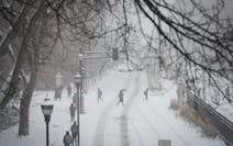Students make their way across a snowy University of Minnesota campus on Tuesday.