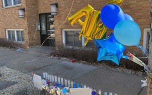 Balloons marked the spot where a woman was fatally shot in March in the Lowry Hill neighborhood of Minneapolis.