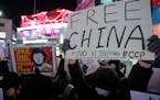 Demonstrators stage a rally to denounce Chinese government’s continued zero-COVID policies in South Korea on Wednesday.
