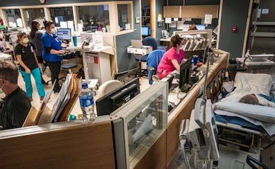 Nurses worked Nov. 3 in an overcrowded emergency department at St. John’s Hospital in Maplewood. Several patients were treated in the hallways while