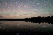 Stars are reflected in Elbow Lake Wednesday, Sep. 28, 2022 on the Gunflint Trail in Grand Marais, Minn. To make this image, a ten-minute exposure was 