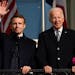 President Joe Biden and French President Emmanuel Macron stand on the Blue Room Balcony during a State Arrival Ceremony on the South Lawn of the White