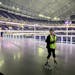 Lee Engele, lead skate guard at U.S. Bank Stadium, cheers on the hardy souls who trudged through the snow for the opening night of Winter Warm-Up. On 