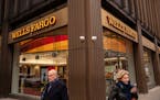 Pedestrians in front of a Wells Fargo bank branch in New York on Jan. 13, 2022. 