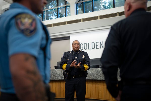 Virgil L. Green, Sr. applauded the members of the Golden Valley Police and Fire Departments as they gathered with him for a photo after he was sworn i