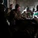 Ukrainian servicemen give the first aid to a soldier wounded in a battle with the Russian troops in their shelter in the Donetsk region, Ukraine, Thur