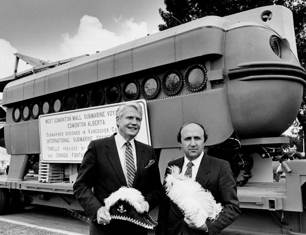 Bloomington Mayor James Lindau stood with developer Bahman Ghermezian in front of a submarine prototype for the future mall. They appeared with admiral's hats at Taste of Minnesota festivities in St. Paul in 1985.