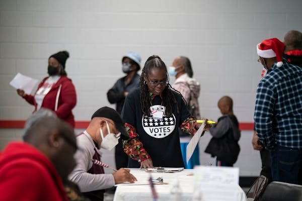 Election workers at the polls during the first day of early voting in the Georgia Runoff Election in Atlanta, Nov. 26, 2022. (Nicole Craine/The New Yo