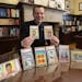 Fr. John Ubel with some of his childhood Baseball cards auctioned in 2021 to fund scholarships to help students to attend Catholic grade schools.