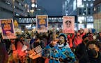Protesters walk the streets of downtown Minneapolis after the police killing of Amir Locke in February. The City Council vote next week on a plan to r