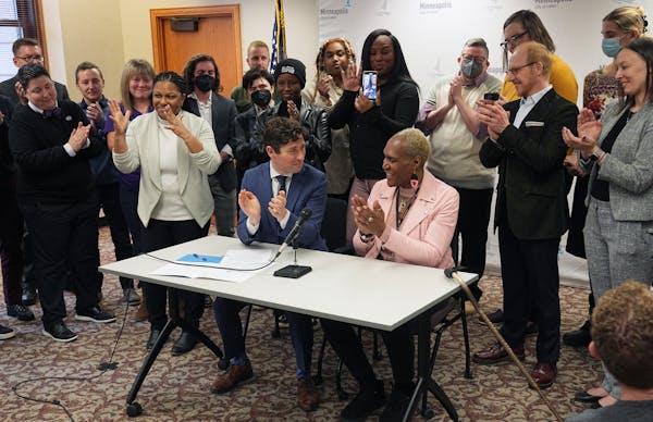 Flanked by supporters and City Council President Andrea Jenkins, Mayor Jacob Frey signed an executive order on Friday that protects people seeking or 