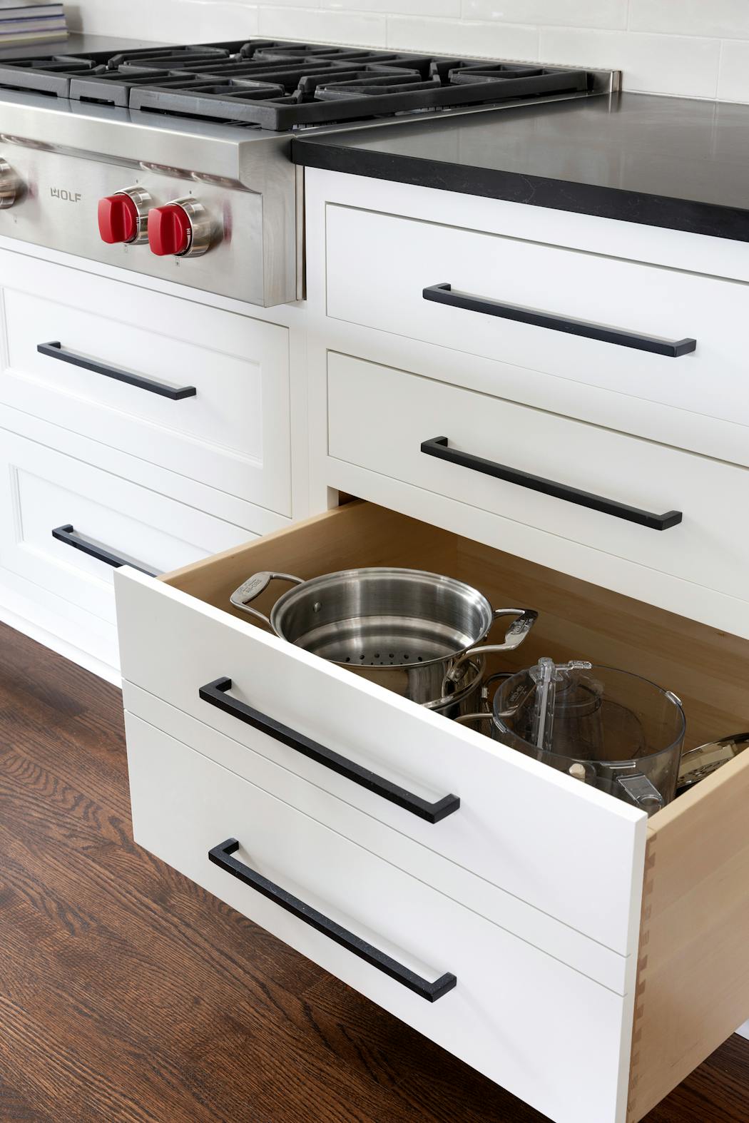 A deep drawer next to the stove stores prep and cookware such as the pasta pot. 