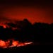 Lava flows from the Mauna Loa volcano Friday, Dec. 2, 2022, near Hilo, Hawaii.